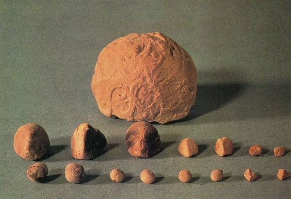 Impressed clay bulla with token contents  from Susa.